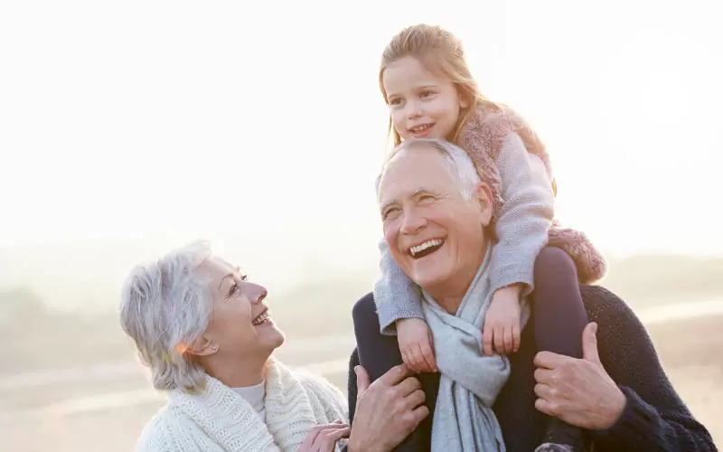 Grandparents and Granddaughter Walking